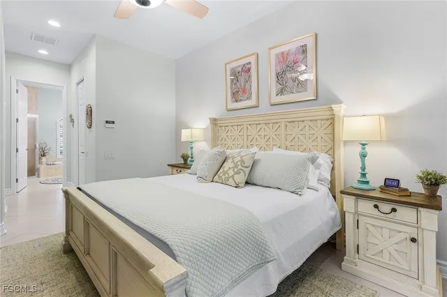 a bathroom with a tub a sink double vanity and a shower