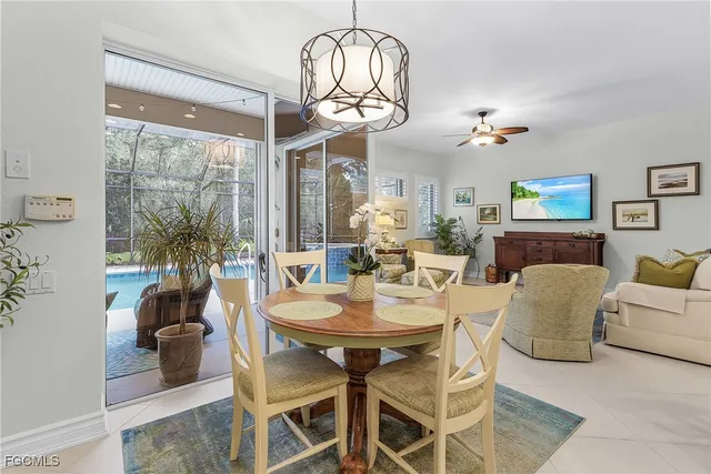 a dining room with furniture a livingroom and chandelier