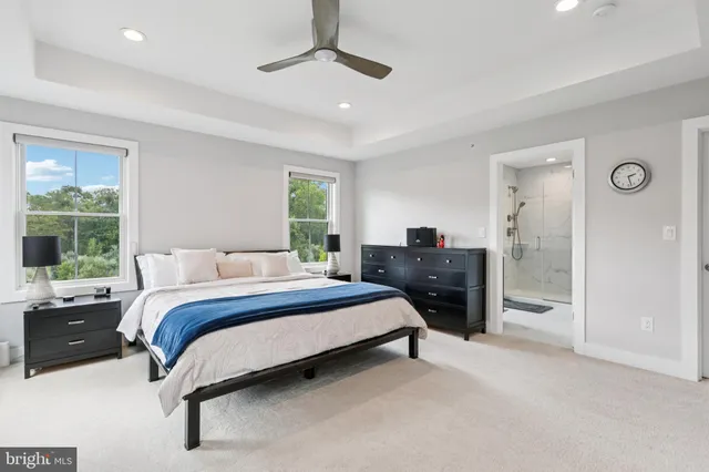 a bedroom with a bed dresser and a window