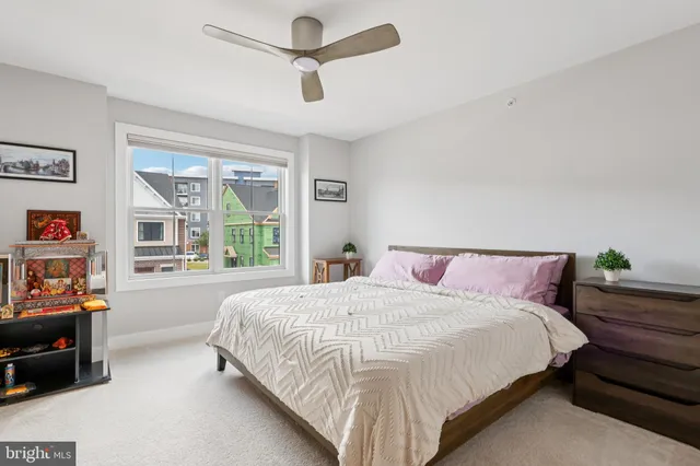 a bedroom with bed and window