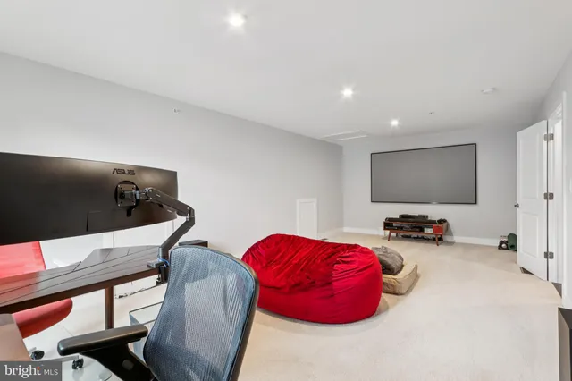 a bedroom with furniture and a flat screen tv