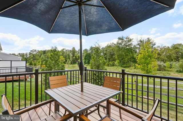 a view of a balcony with wooden floor