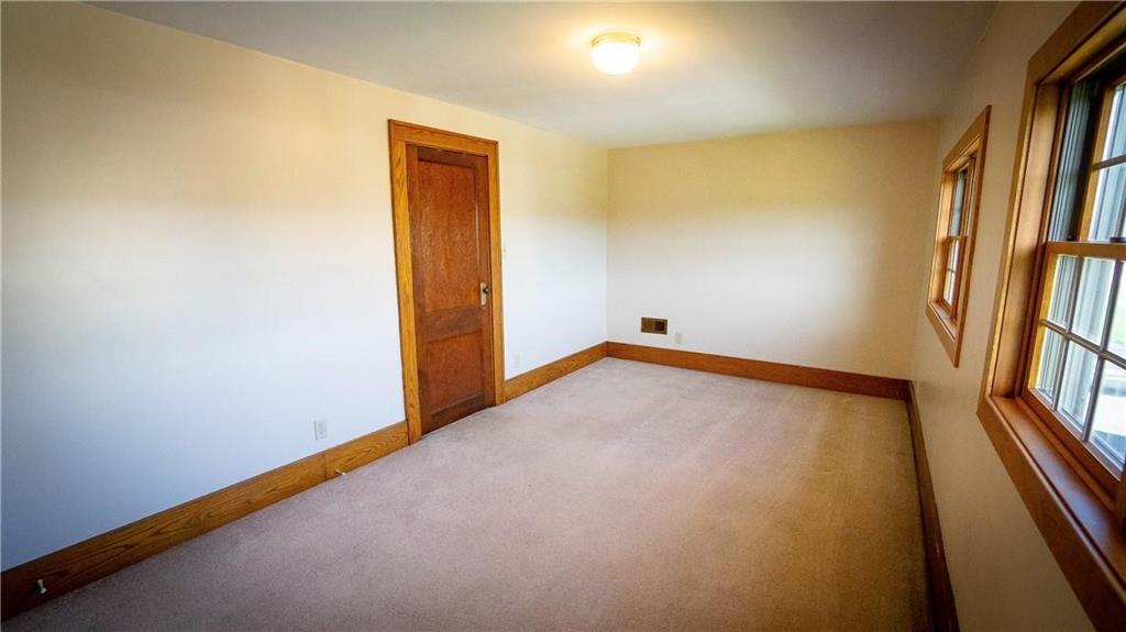 138 Shannon Road Renfrew, PA 16053 - Photo 13 of 25 an empty room with wooden floor and a window