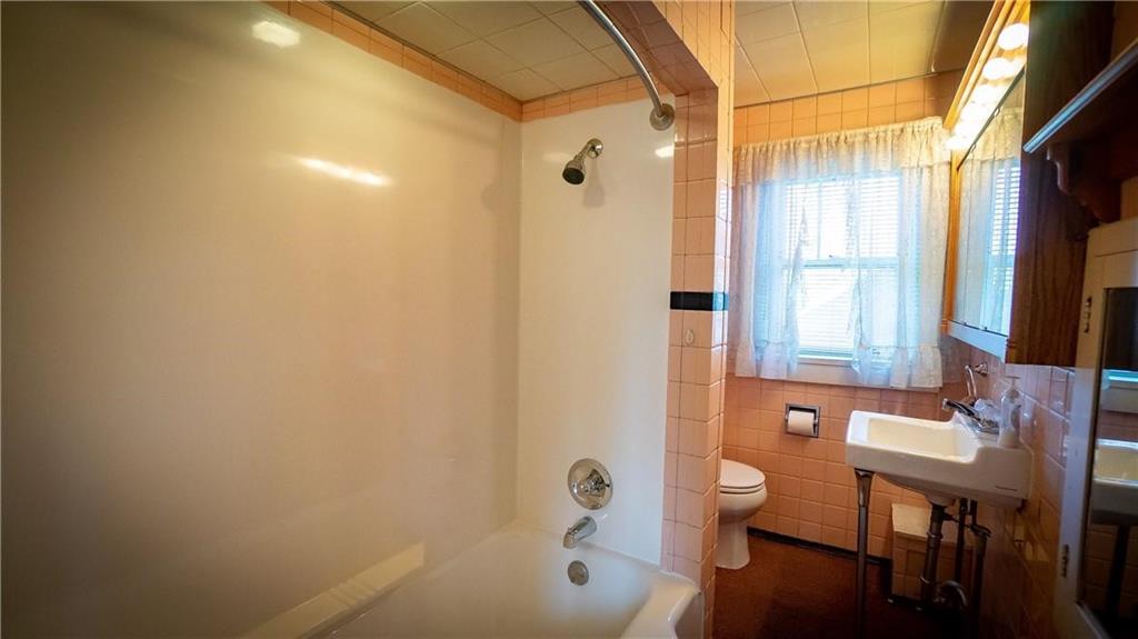 138 Shannon Road Renfrew, PA 16053 - Photo 15 of 25 a bathroom with a bathtub shower sink and toilet