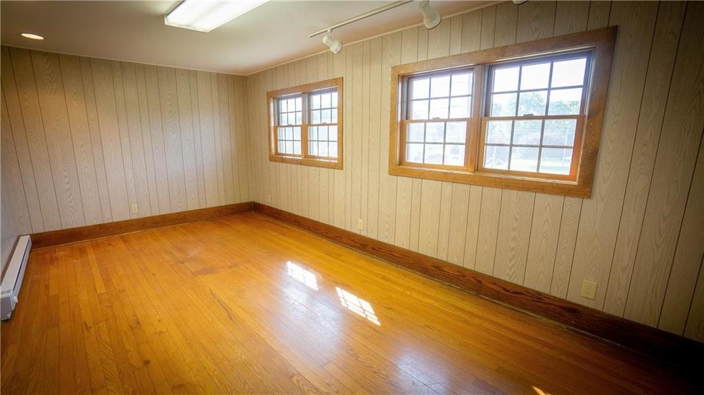138 Shannon Road Renfrew, PA 16053 - Photo 16 of 25 an empty room with wooden floor and windows