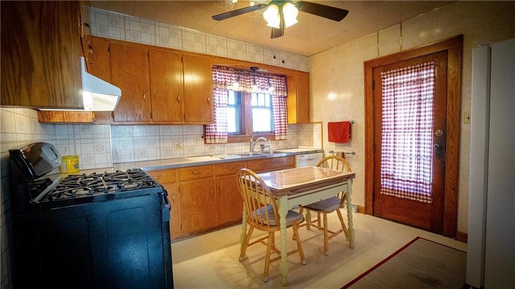138 Shannon Road Renfrew, PA 16053 - Photo 8 of 25 a kitchen with a sink a stove and a refrigerator