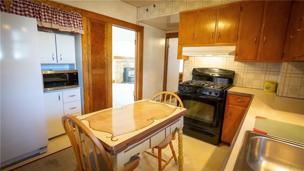 138 Shannon Road Renfrew, PA 16053 - Photo 9 of 25 a kitchen with a sink a stove and cabinets