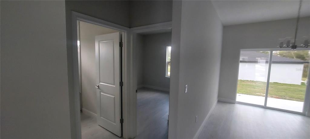 2673 Southwest 156th Place Ocala, FL 34473 - Photo 10 of 14 a view of empty room with wooden floor and fan