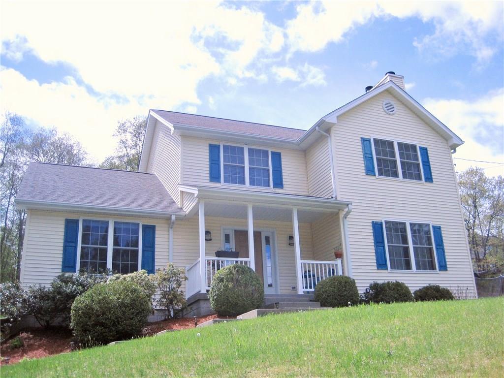 224 Middle River Road Danbury, CT 06811 - Photo 1 of 1 a front view of a house with garden and porch