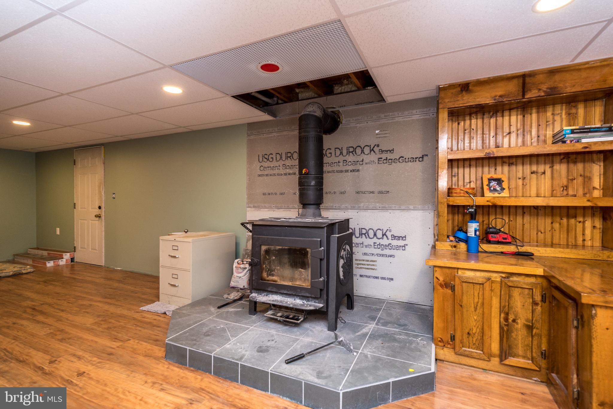 568 Kulp Road Perkiomenville, PA 18074 - Photo 29 of 34 Wood Stove in basement