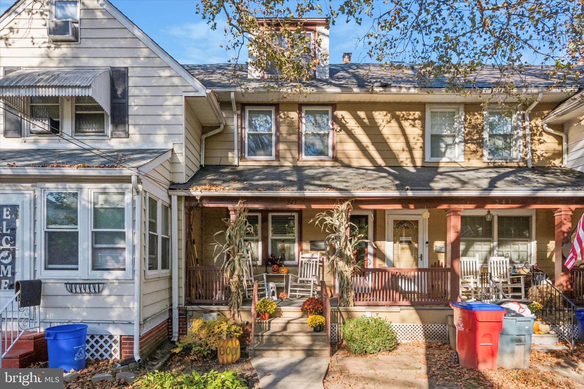 a front view of a building with outdoor seating