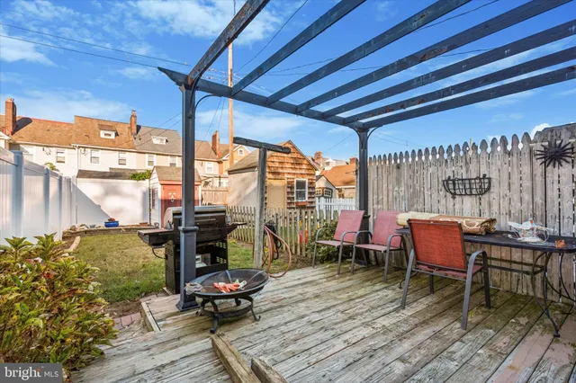 a sitting area with furniture on wooden deck