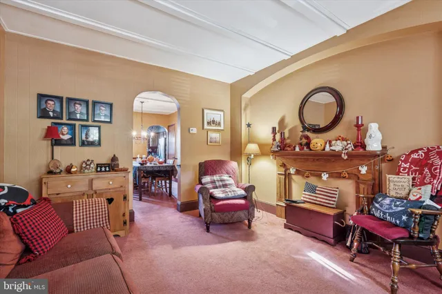 a living room with furniture and a chair