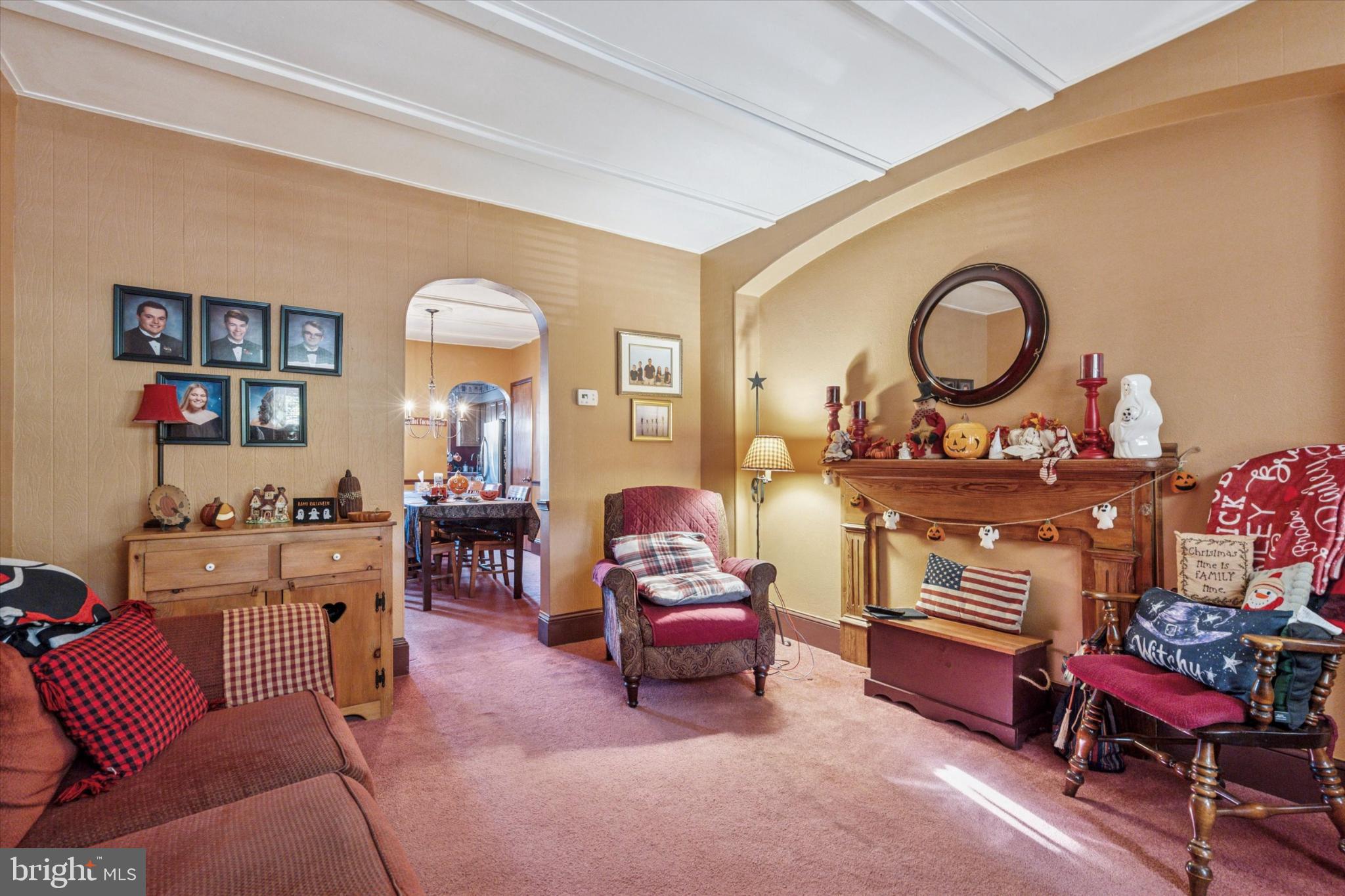 243 Monroe Street Bristol, PA 19007 - Photo 3 of 15 a living room with furniture and a chair