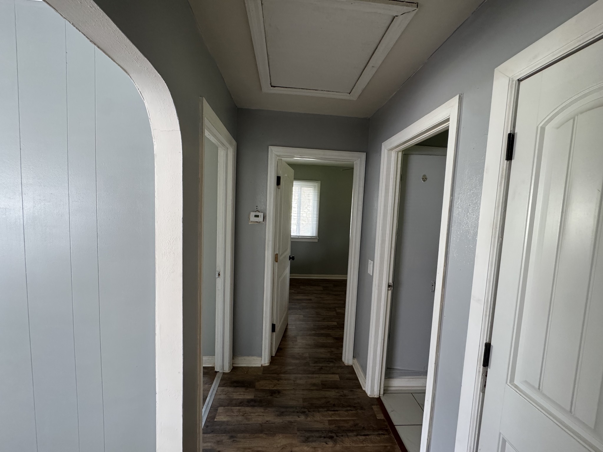 402 East Locust Street Princeton, KY 42445 - Photo 12 of 32 a view of a hallway with wooden floor and stairs