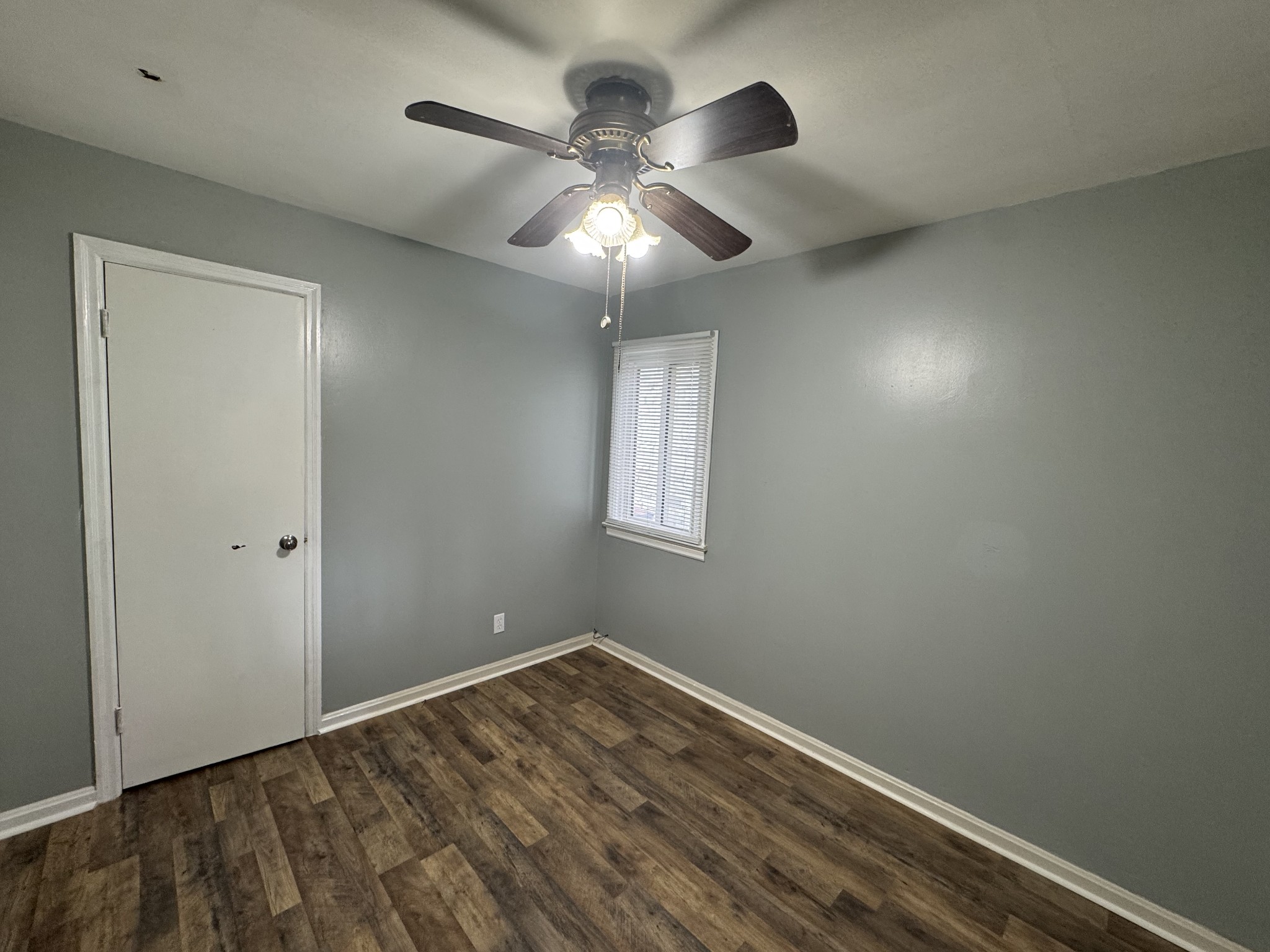 402 East Locust Street Princeton, KY 42445 - Photo 16 of 32 a view of empty room with wooden floor and fan
