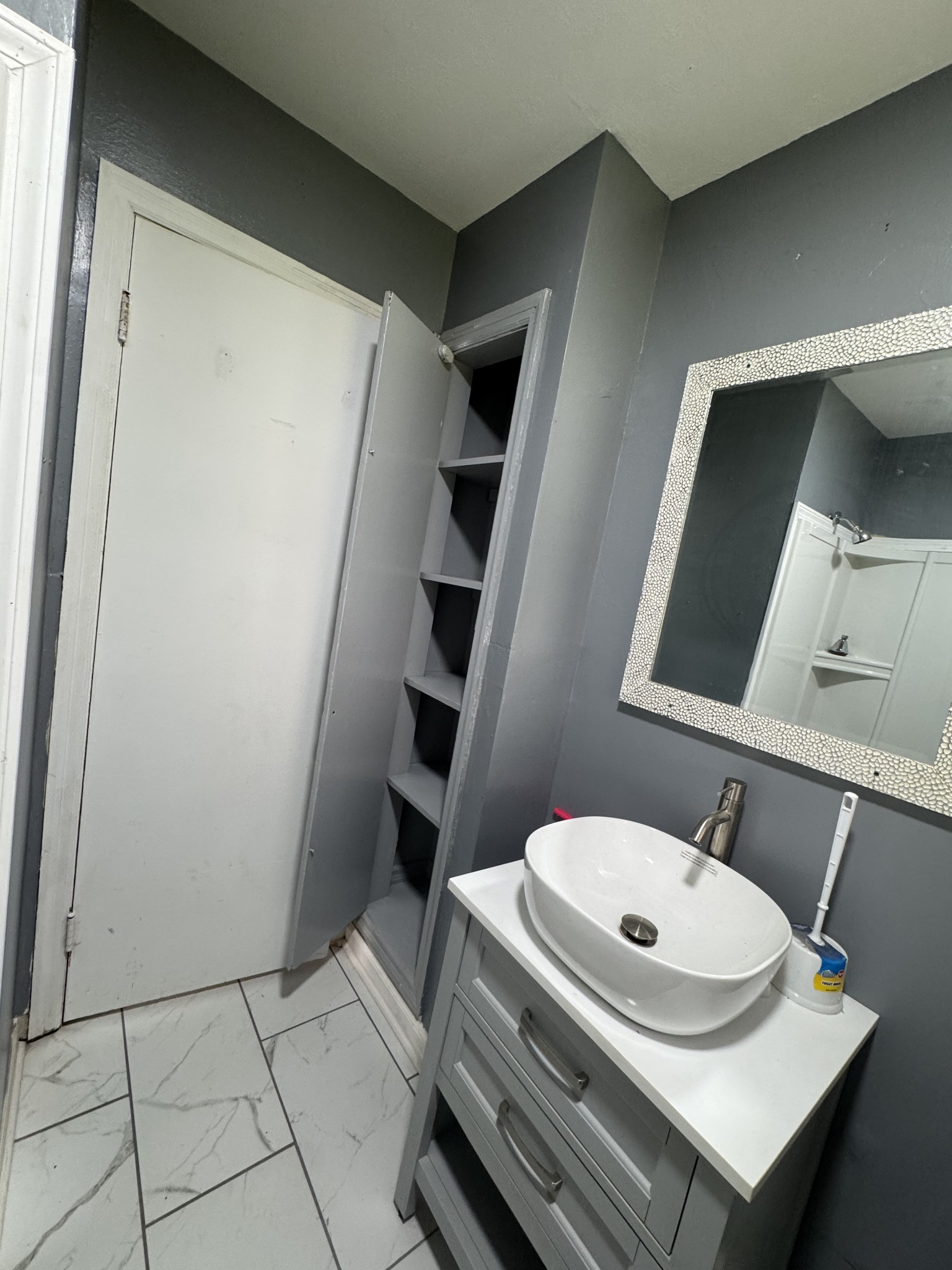 402 East Locust Street Princeton, KY 42445 - Photo 18 of 32 a bathroom with a sink a toilet and shower