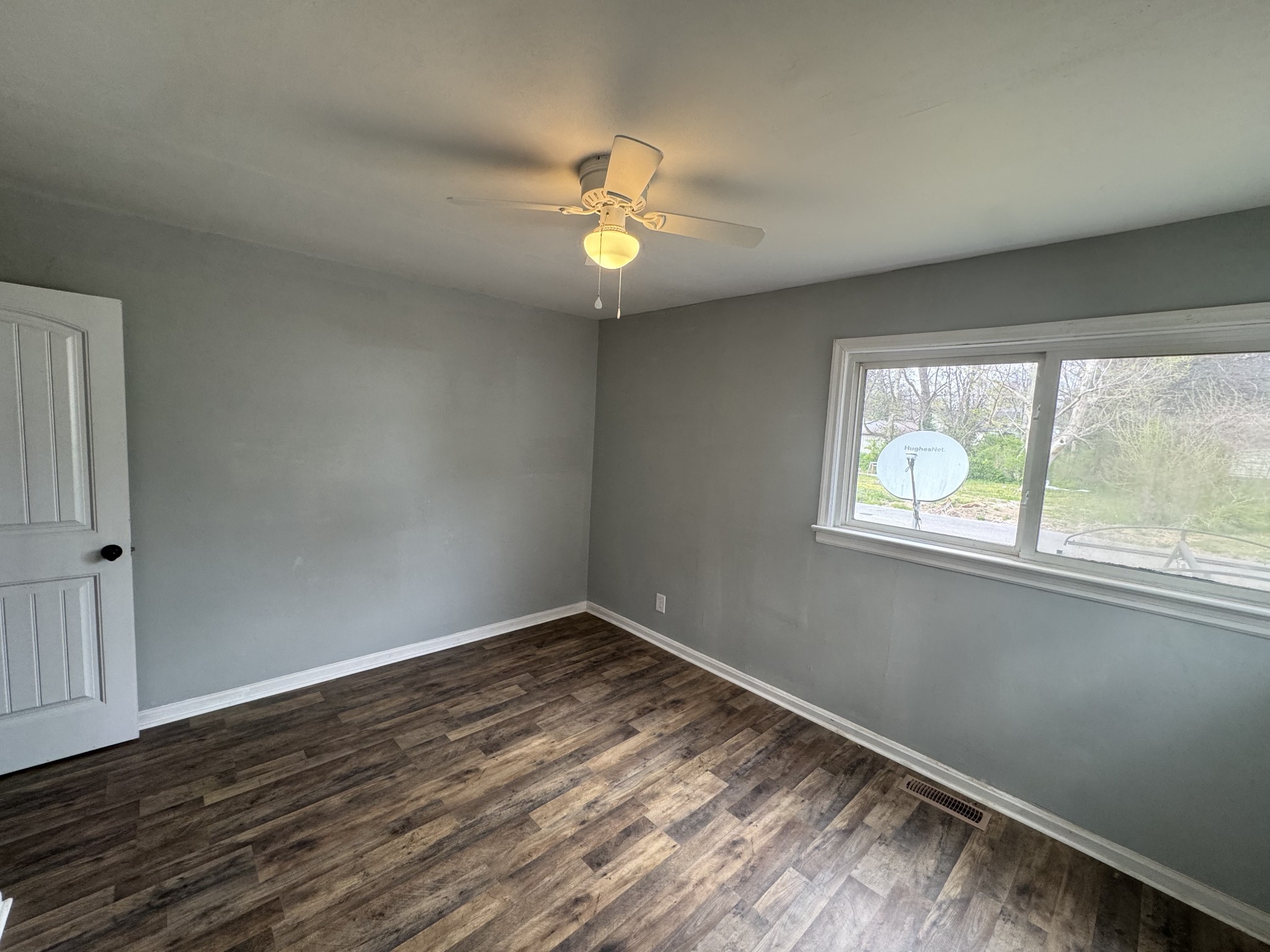 402 East Locust Street Princeton, KY 42445 - Photo 19 of 32 a view of empty room with wooden floor and fan