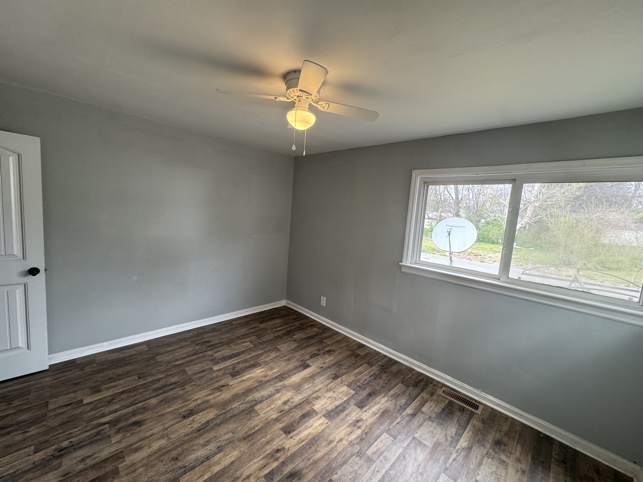 402 East Locust Street Princeton, KY 42445 - Photo 22 of 32 wooden floor in an empty room with a window