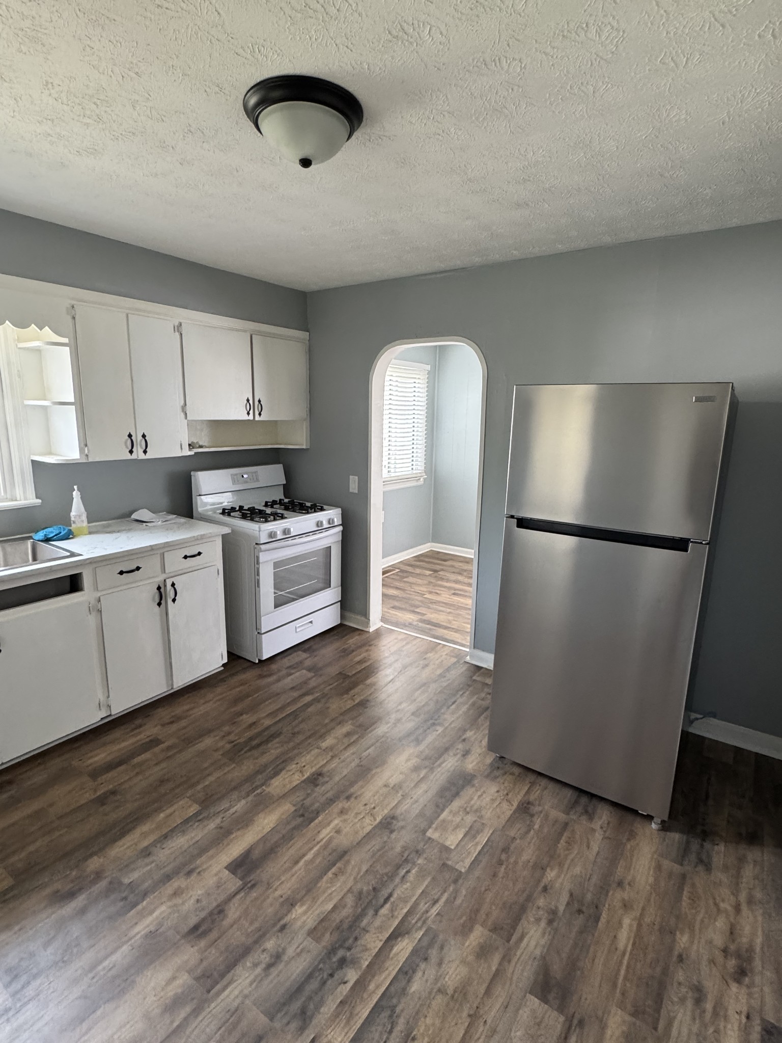 402 East Locust Street Princeton, KY 42445 - Photo 27 of 32 a kitchen with a refrigerator a sink and dishwasher