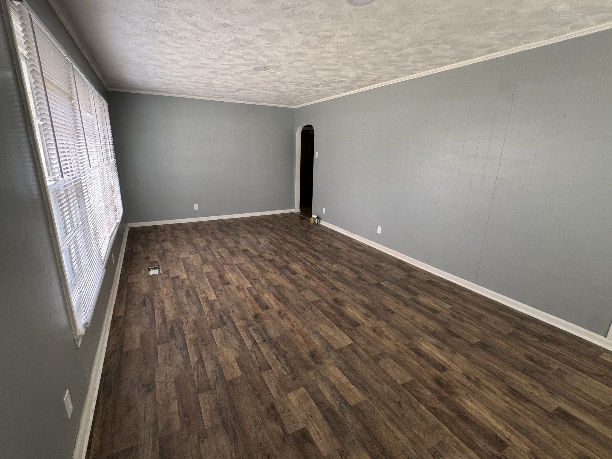 402 East Locust Street Princeton, KY 42445 - Photo 3 of 32 a view of a room with wooden floor and window