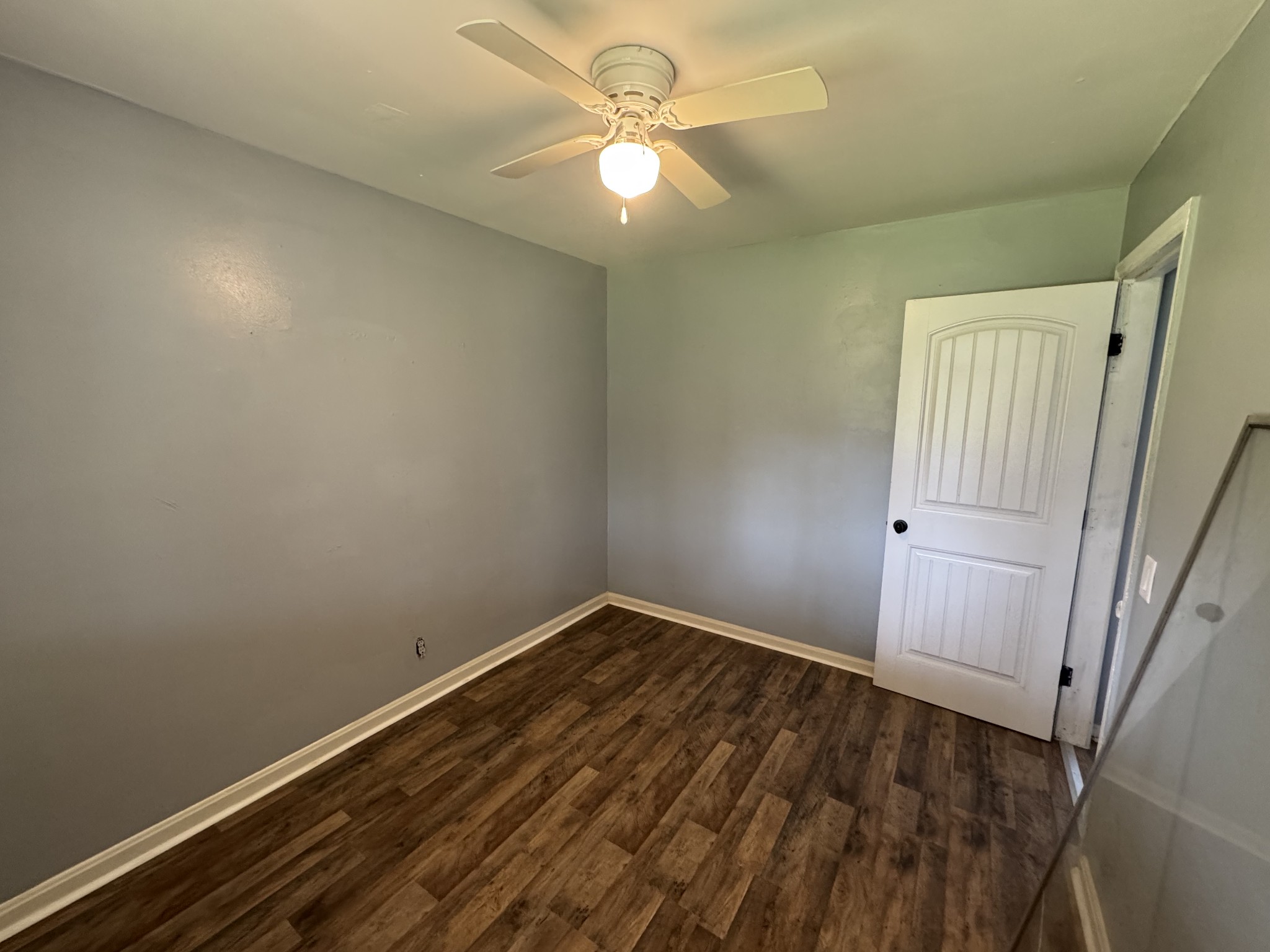 402 East Locust Street Princeton, KY 42445 - Photo 10 of 32 an empty room with a window and a fan