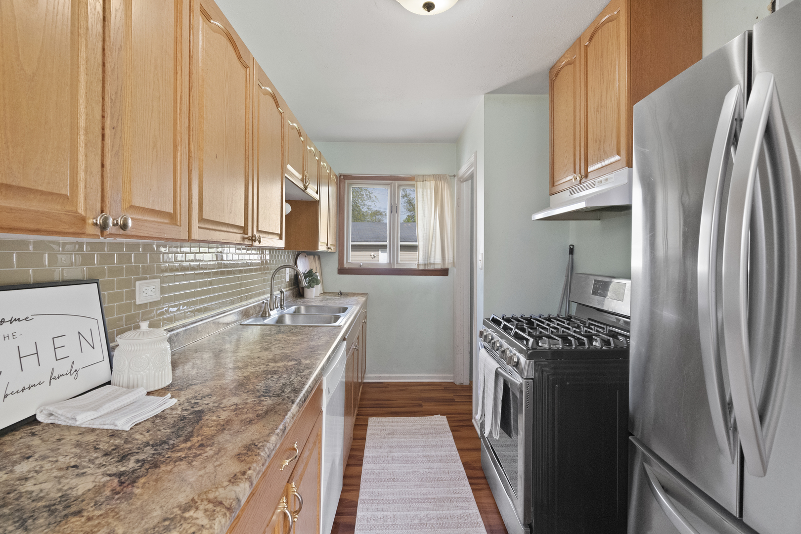 2832 Osage Circle Waukegan, IL 60087 - Photo 11 of 21 a kitchen with stainless steel appliances granite countertop a refrigerator a stove and a sink