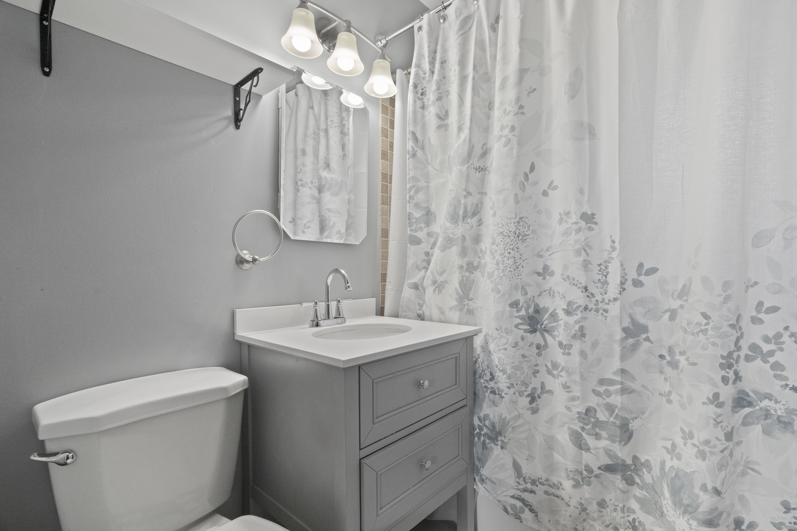 2832 Osage Circle Waukegan, IL 60087 - Photo 16 of 21 a bathroom with a sink a toilet and a mirror