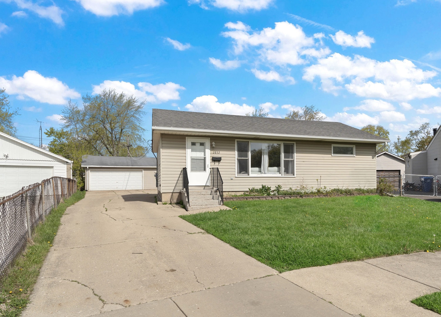 2832 Osage Circle Waukegan, IL 60087 - Photo 2 of 21 a front view of a house with a garden