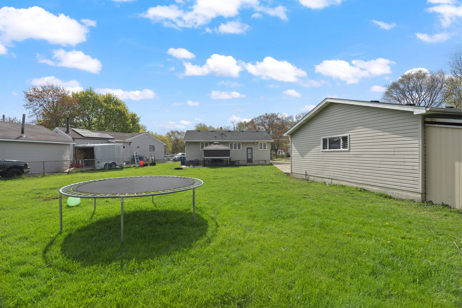 2832 Osage Circle Waukegan, IL 60087 - Photo 21 of 21 a view of a backyard with a garden and entertaining space