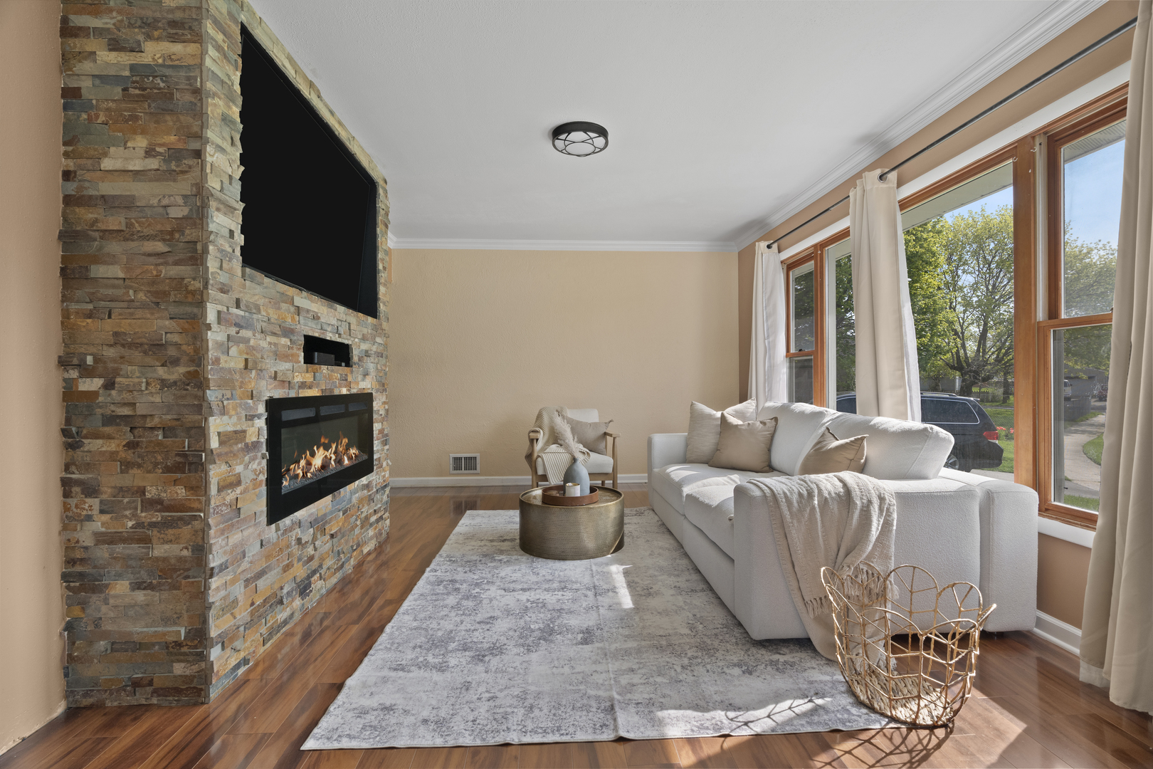 2832 Osage Circle Waukegan, IL 60087 - Photo 4 of 21 a living room with furniture a flat screen tv and a fireplace