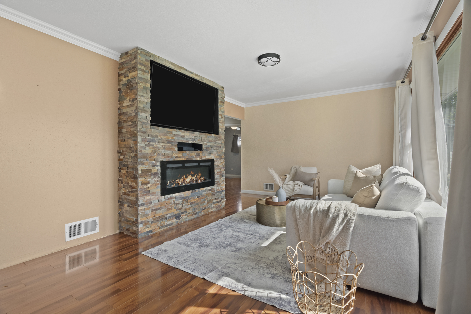 2832 Osage Circle Waukegan, IL 60087 - Photo 7 of 21 a living room with furniture a flat screen tv and a fireplace