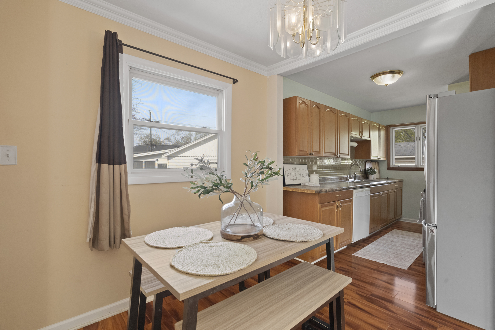 2832 Osage Circle Waukegan, IL 60087 - Photo 8 of 21 a kitchen with a dining table chairs and refrigerator