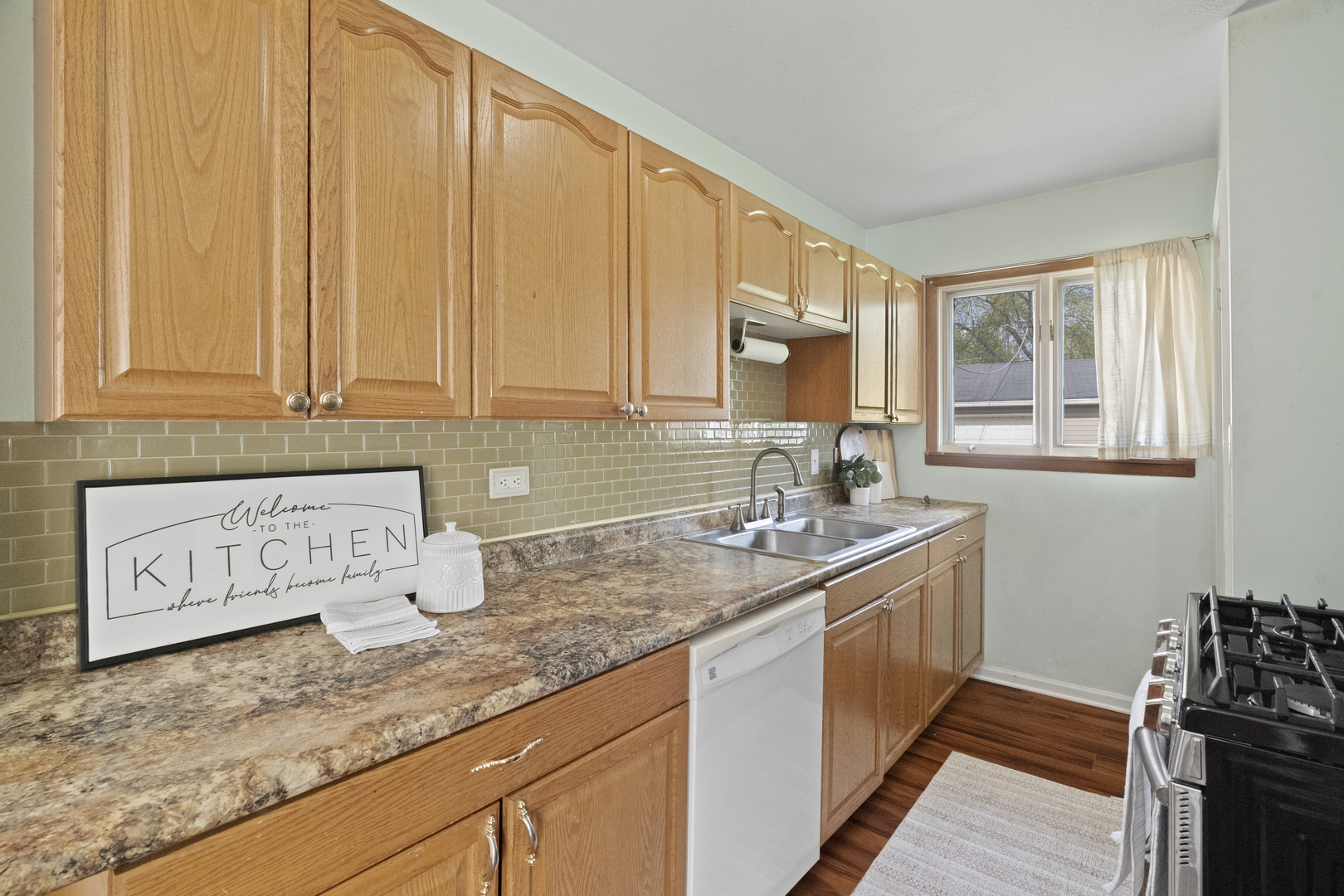2832 Osage Circle Waukegan, IL 60087 - Photo 10 of 21 a kitchen with stainless steel appliances granite countertop a sink stove and cabinets