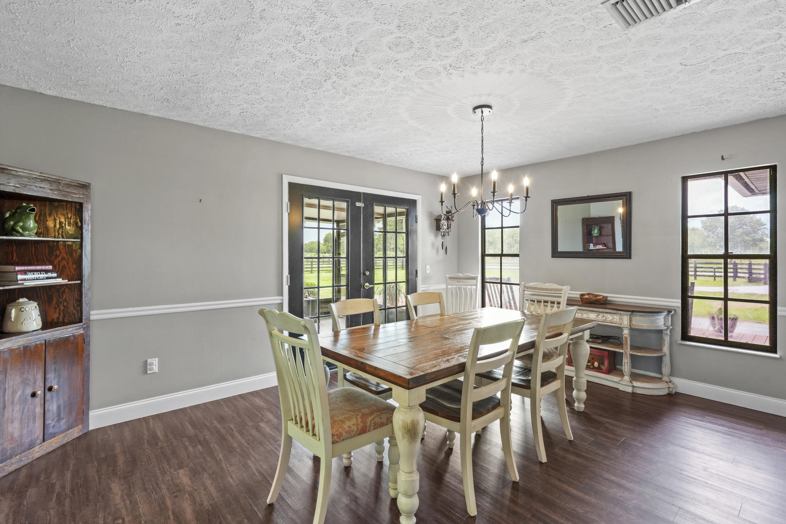 4170 McCarty Road Fort Pierce, FL 34945 - Photo 23 of 57 a view of a dining room with furniture window and wooden floor