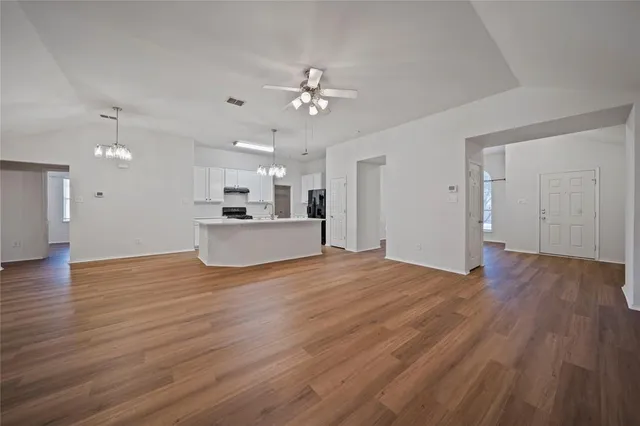 a view of a kitchen with a sink and a kitchen counter top space