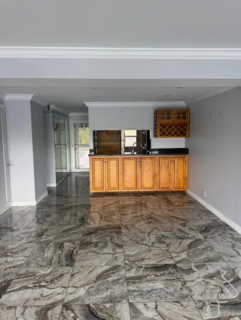 a kitchen with granite countertop a stove and a microwave