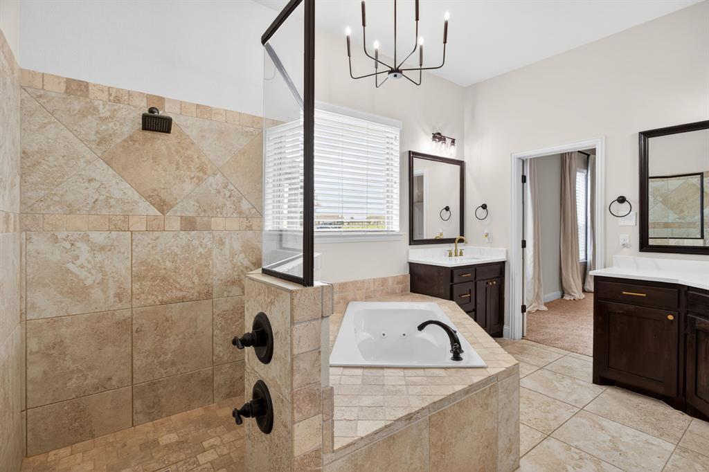 7320 Spring Ranch Court Godley, TX 76044 - Photo 25 of 38 a bathroom with a sink a granite counter and a mirror