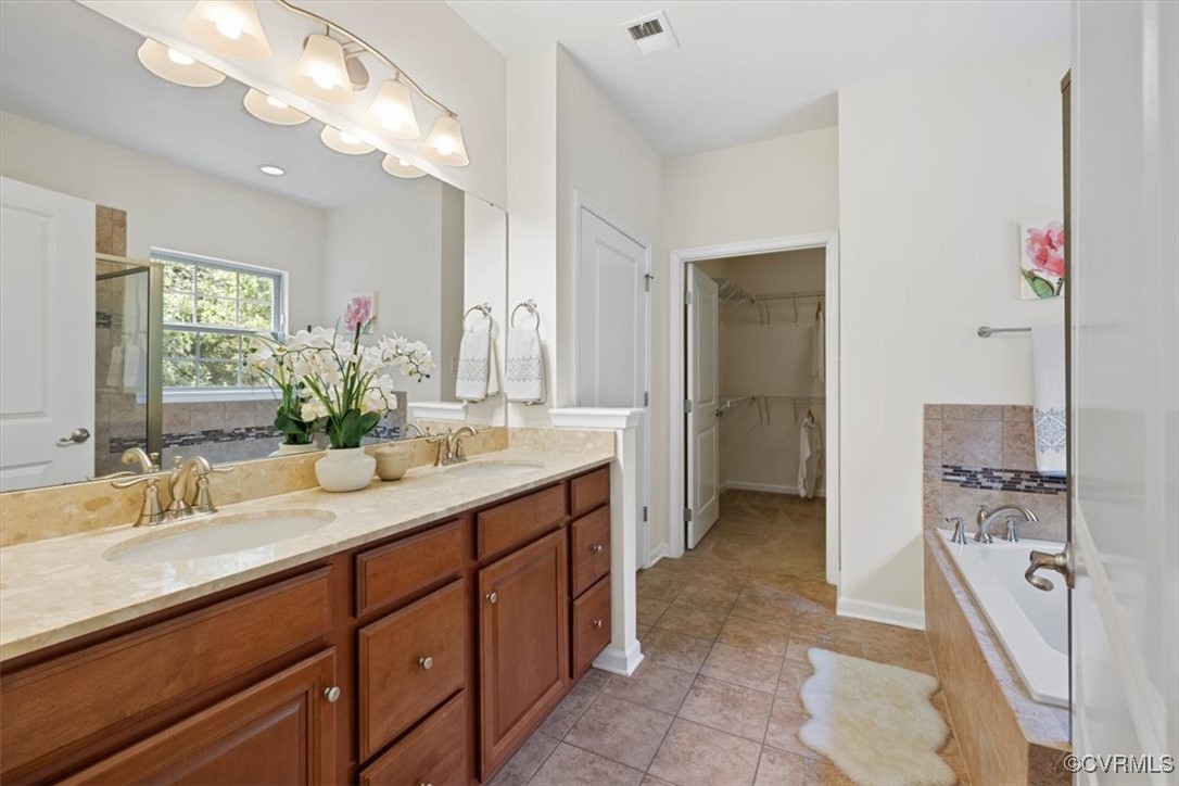 5801 Riverside Trail Richmond, VA 23225 - Photo 16 of 35 Bathroom with double vanity, tile patterned floori