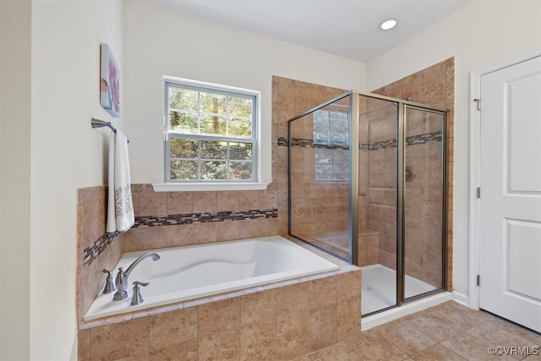 5801 Riverside Trail Richmond, VA 23225 - Photo 17 of 35 Full bath featuring a bath, a stall shower, and ti