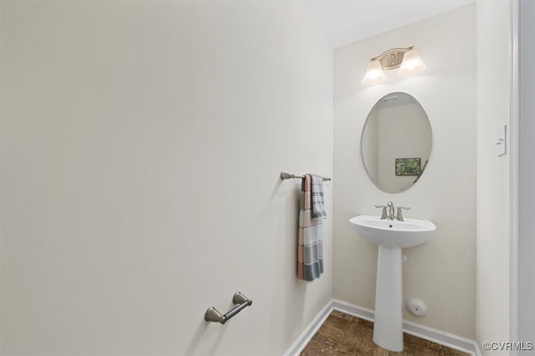 5801 Riverside Trail Richmond, VA 23225 - Photo 20 of 35 Bathroom with baseboards and a sink
