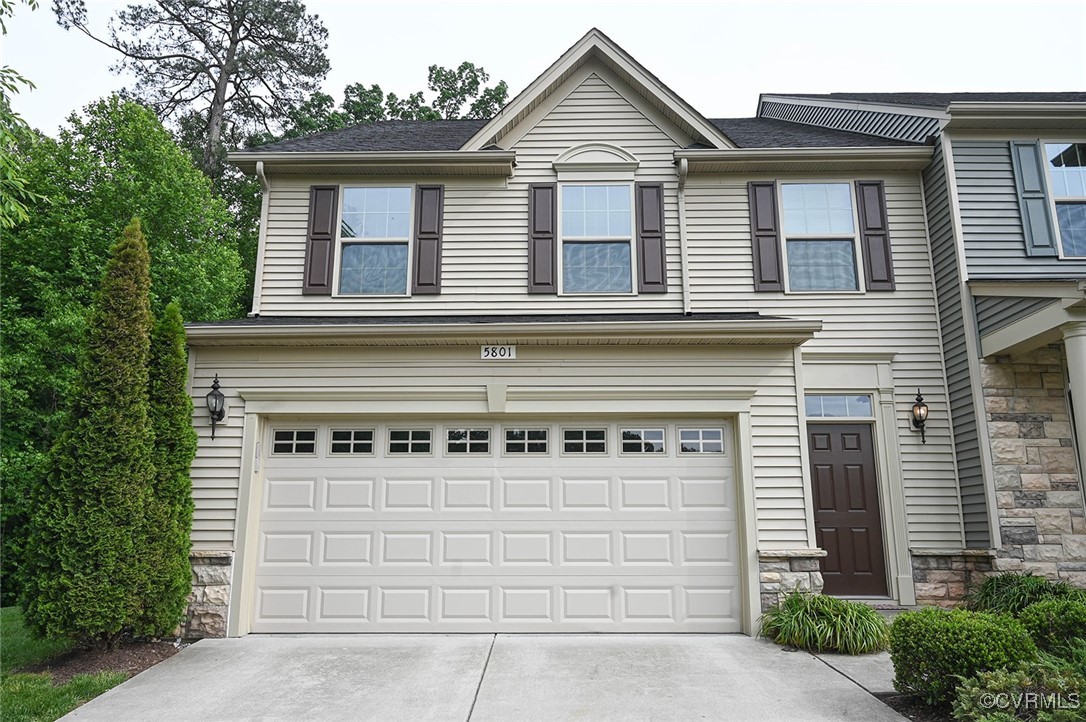 5801 Riverside Trail Richmond, VA 23225 - Photo 2 of 35 View of front facade with a garage, driveway, and