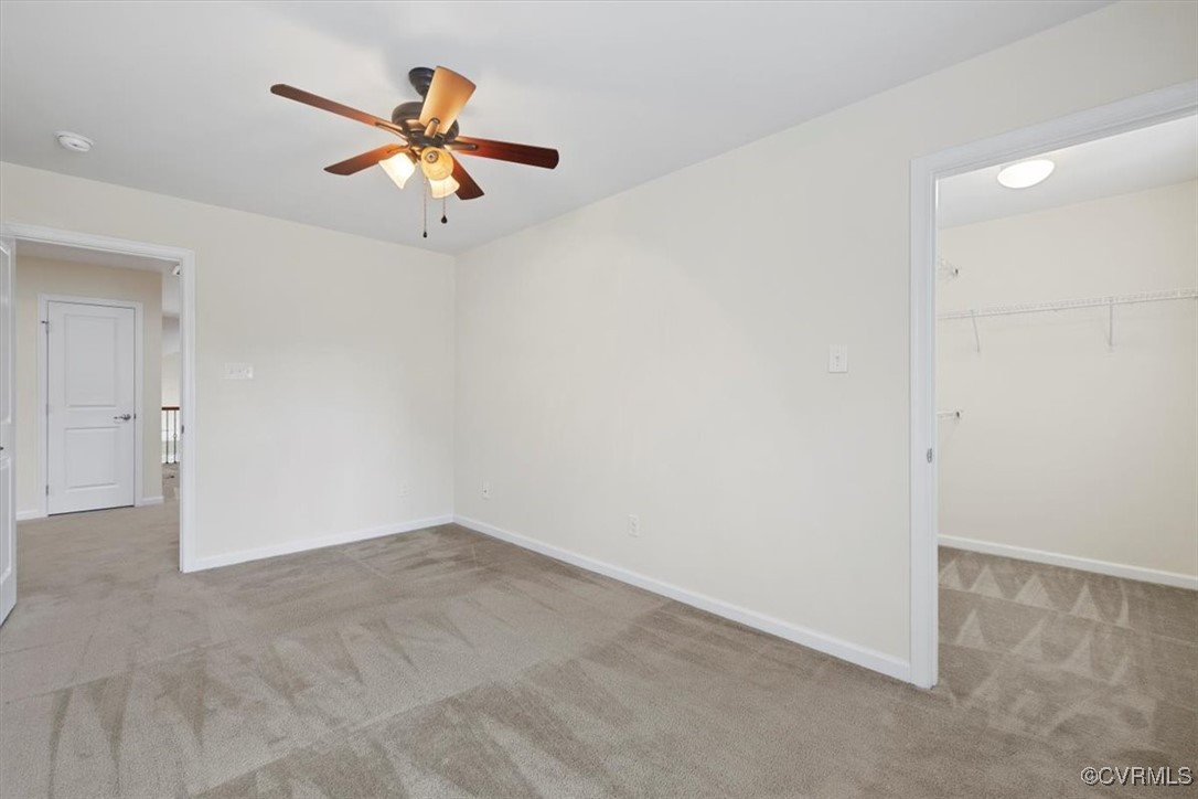 5801 Riverside Trail Richmond, VA 23225 - Photo 29 of 35 Carpeted empty room featuring a ceiling fan, baseb