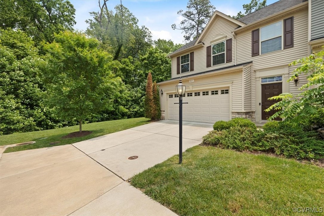 5801 Riverside Trail Richmond, VA 23225 - Photo 34 of 35 View of home's exterior with a garage, concrete dr