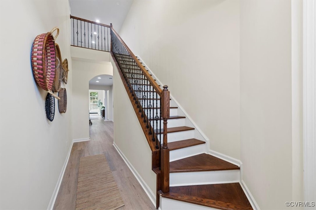 5801 Riverside Trail Richmond, VA 23225 - Photo 4 of 35 Stairs with arched walkways, wood finished floors,
