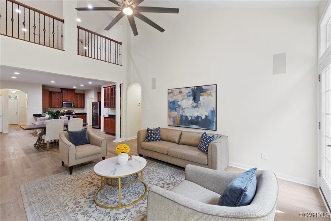 5801 Riverside Trail Richmond, VA 23225 - Photo 7 of 35 Living area featuring arched walkways, baseboards,