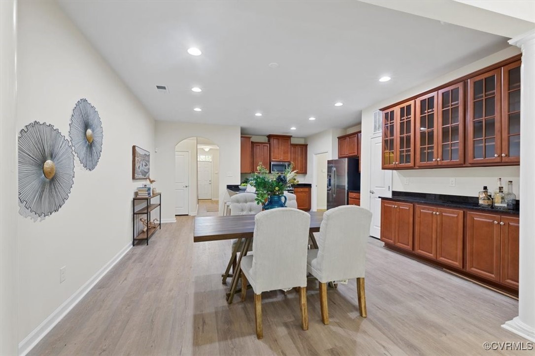 5801 Riverside Trail Richmond, VA 23225 - Photo 8 of 35 Dining room featuring arched walkways, light wood-