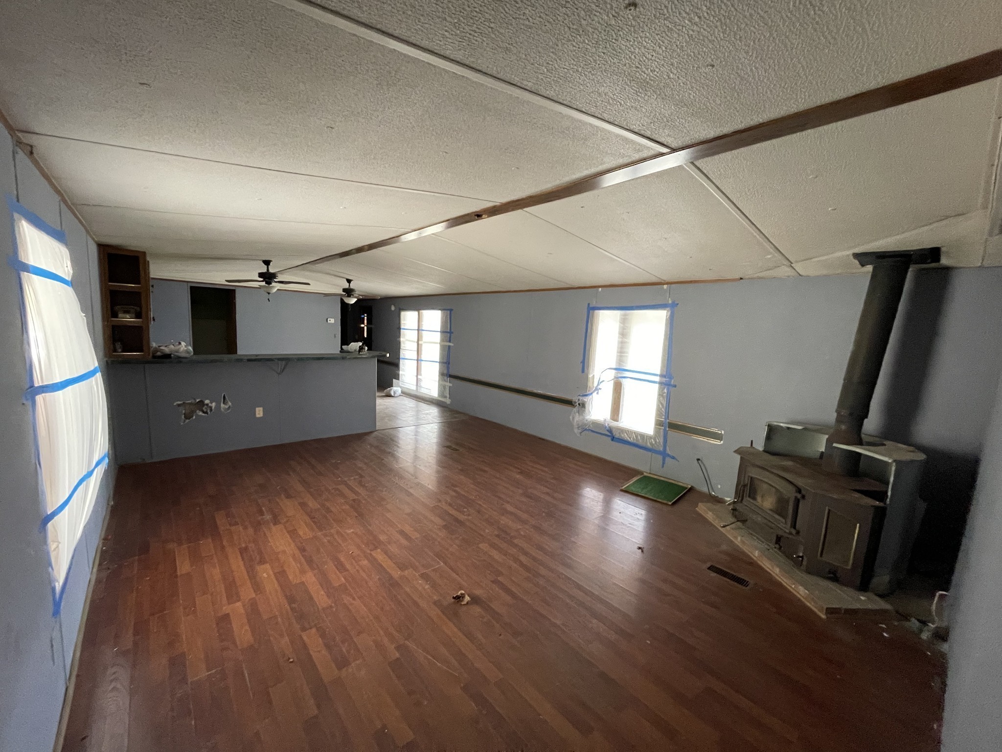 250 Possum Hollow Road Dowelltown, TN 37059 - Photo 17 of 31 a view of a livingroom with wooden floor and stairs