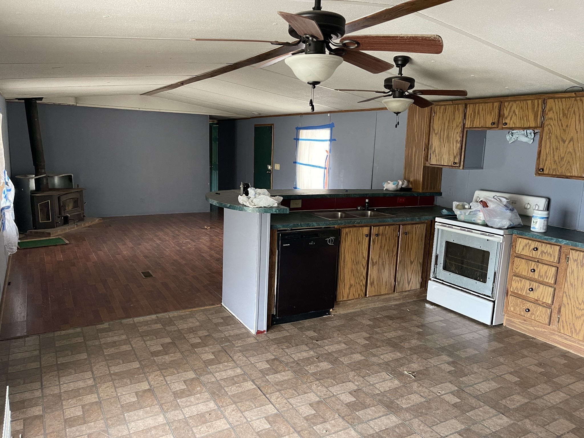 250 Possum Hollow Road Dowelltown, TN 37059 - Photo 20 of 31 a kitchen with stainless steel appliances granite countertop a stove and a sink