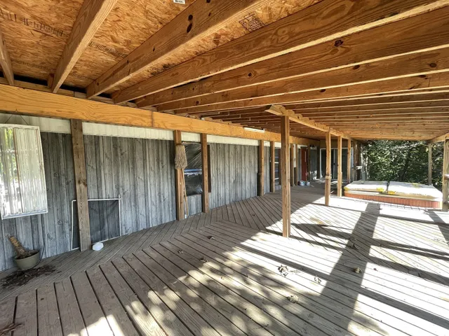 a view of balcony with wooden floor